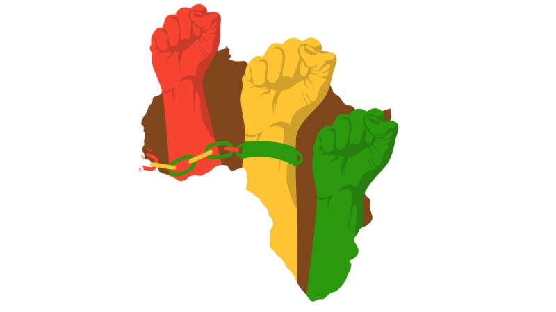 Mãos levantadas com punhos cerrados, representando união e direitos humanos.